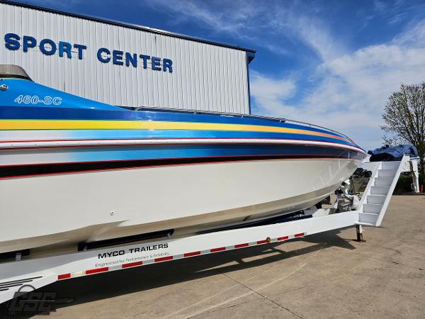 Slide: The Image of 2002 Black Thunder 460 SC boat on trailer at sport center. - 5