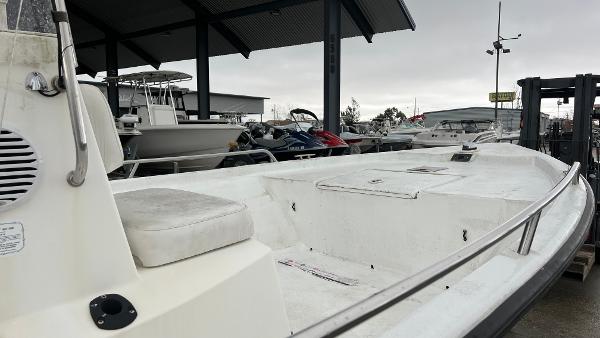 Slide: The Image of Boat docked in marina, Blazer 1860 model, year 2000, with overcast sky. - 11