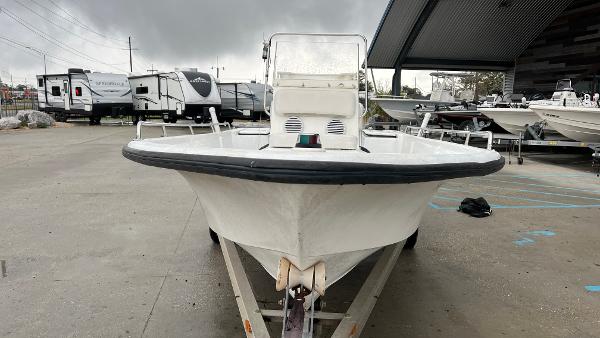 Slide: The Image of Front view of a 2000 Blazer 1860 boat on a trailer in a parking lot. - 5