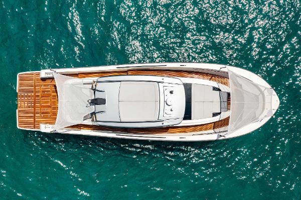 Slide: The Image of Aerial view of 2019 Bluegame BG62 yacht on turquoise water. - 1
