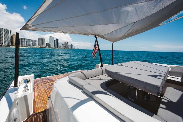 Slide: The Image of 2019 Bluegame BG62 yacht with city skyline and ocean view. - 10