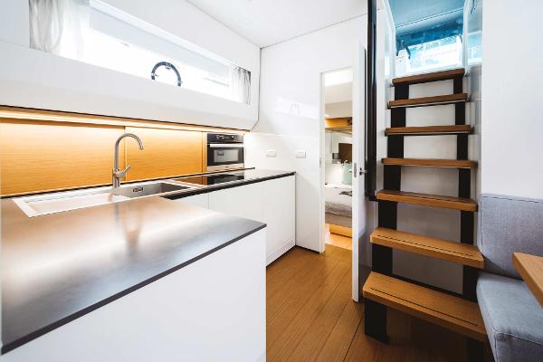 Slide: The Image of Modern kitchen and staircase in 2019 Bluegame BG62 yacht. - 19