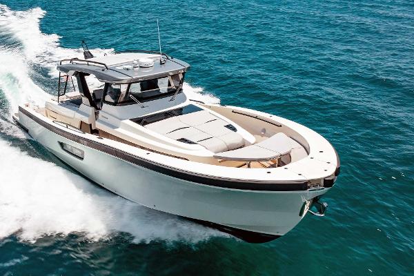 Slide: The Image of 2019 Bluegame BG62 yacht cruising on open water. - 2