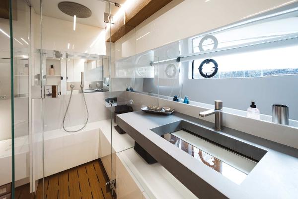 Slide: The Image of Luxurious bathroom in 2019 Bluegame BG62 yacht with modern fixtures and glass shower. - 22