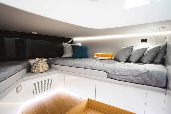 Slide: The Image of Modern interior cabin of 2019 Bluegame BG62 yacht with cozy bedding and ambient lighting. - 25