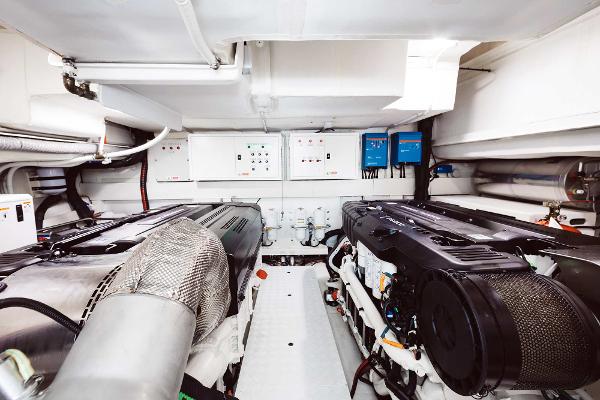 Slide: The Image of Engine room of 2019 Bluegame BG62 yacht with dual engines and control panels. - 27