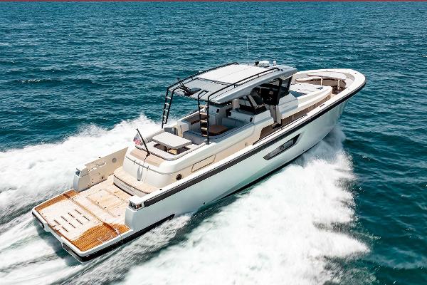 Slide: The Image of 2019 Bluegame BG62 yacht cruising on open water. - 6