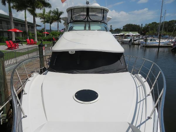 Slide: The Image of Bluewater 5800 yacht docked at marina, 2000 model, front view with clear skies. - 17