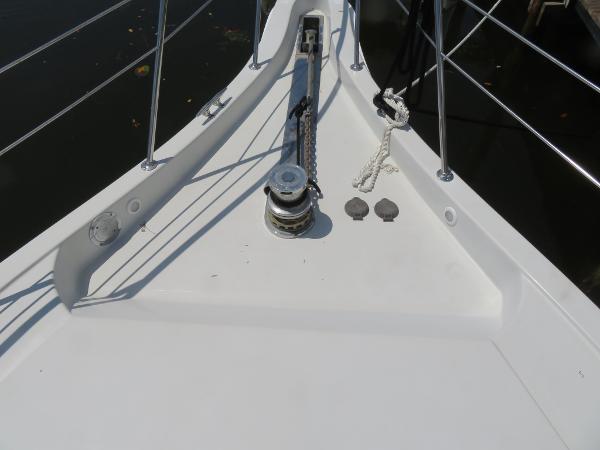 Slide: The Image of Bow deck of a 2000 Bluewater 5800 yacht with anchor winch. - 18