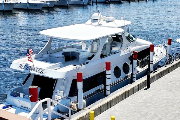Slide: The Image of Luxury Bluewater 5800 yacht docked at marina, 2000 model. - 2