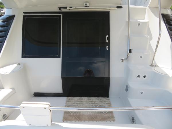 Slide: The Image of Bluewater 5800 yacht rear deck with black door and steps, 2000 model. - 24