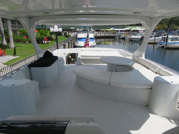 Slide: The Image of Spacious deck of a 2000 Bluewater 5800 yacht docked at a marina. - 26