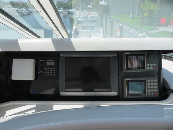 Slide: The Image of Control panel of a 2000 Bluewater 5800 yacht with navigation screens. - 44