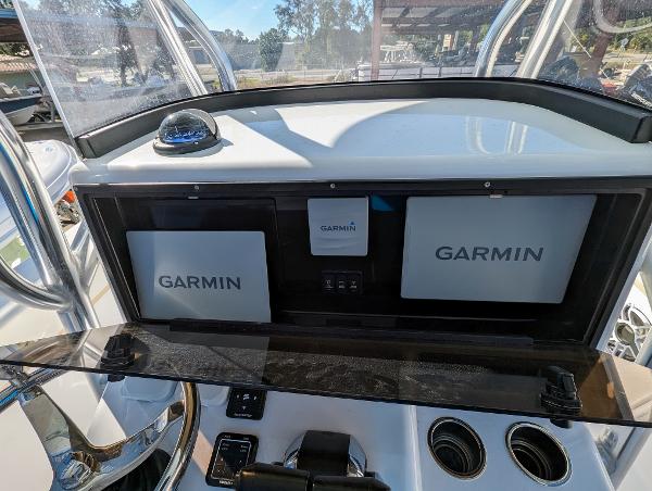 Slide: The Image of 2024 Bluewater Sportfishing 2850 boat dashboard with Garmin navigation systems. - 10