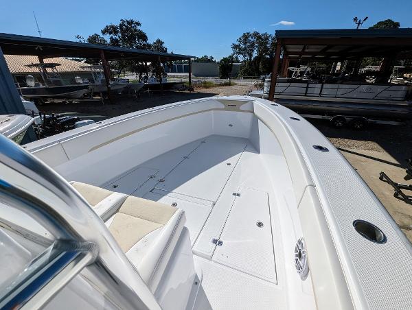 Slide: The Image of 2024 Bluewater Sportfishing 2850 boat with spacious deck and seating area. - 12