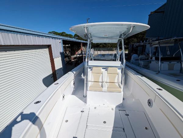 Slide: The Image of 2024 Bluewater Sportfishing 2850 boat with T-top and dual seating. - 13