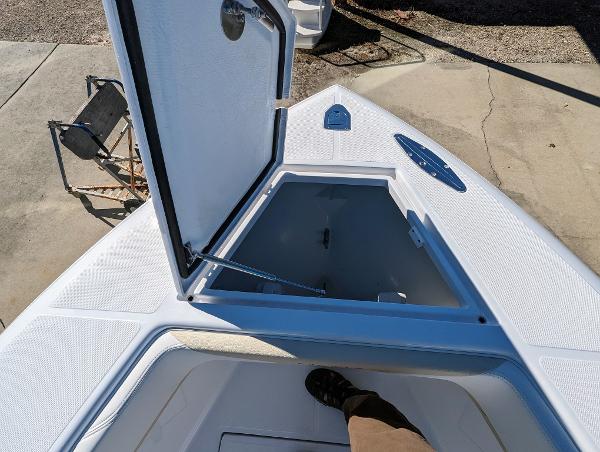 Slide: The Image of 2024 Bluewater Sportfishing 2850 boat with open storage compartment on deck. - 14