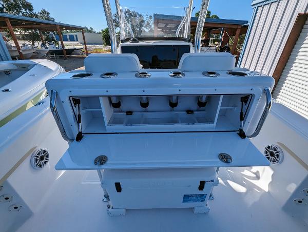 Slide: The Image of 2024 Bluewater Sportfishing 2850 boat with open storage compartments. - 24