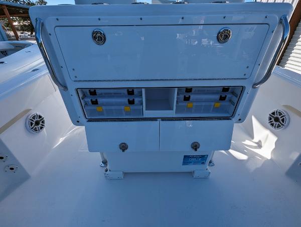 Slide: The Image of 2024 Bluewater Sportfishing 2850 boat storage compartments and tackle station. - 25