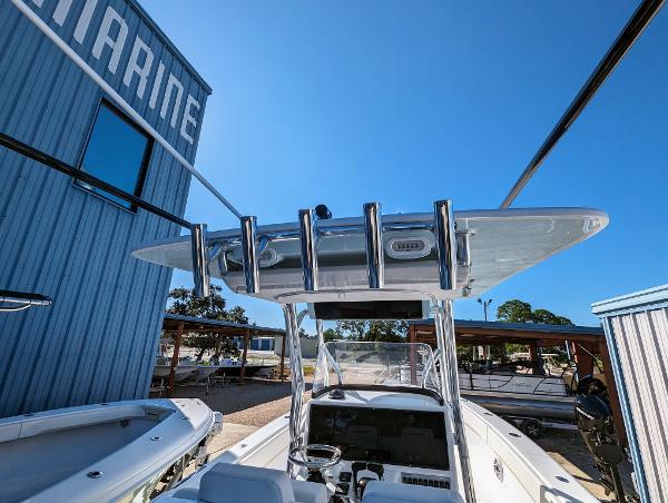 Slide: The Image of 2024 Bluewater Sportfishing 2850 boat docked near a marine building. - 28