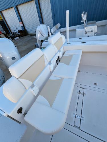 Slide: The Image of 2024 Bluewater Sportfishing 2850 boat with white and beige seating. - 29
