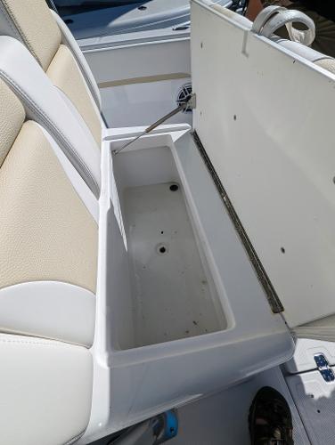 Slide: The Image of 2024 Bluewater Sportfishing 2850 boat with open storage compartment under seat. - 30