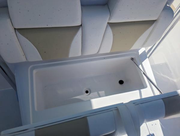 Slide: The Image of 2024 Bluewater Sportfishing 2850 boat interior seating and storage compartment. - 35
