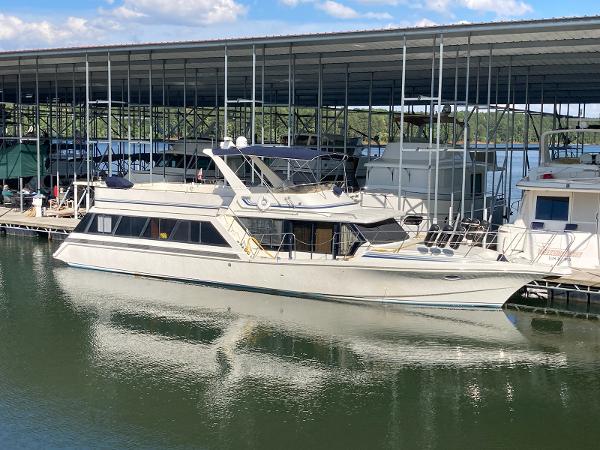 Slide: The Image of 1989 Bluewater Yachts 55' Coastal Cruiser docked at marina. - 1