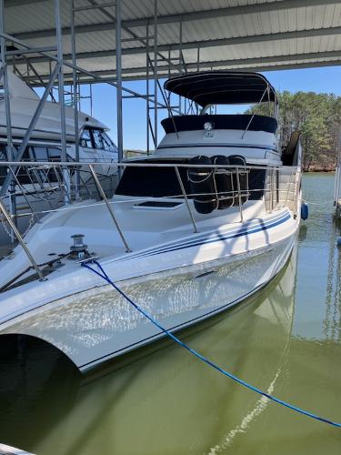 Slide: The Image of 1989 Bluewater Yachts 55' Coastal Cruiser docked in a marina. - 2