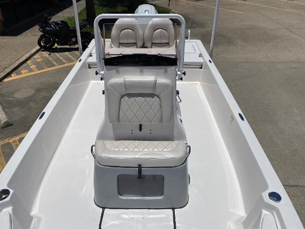 Slide: The Image of 2023 Blue Wave 2200 STL boat with white seating and spacious deck. - 11