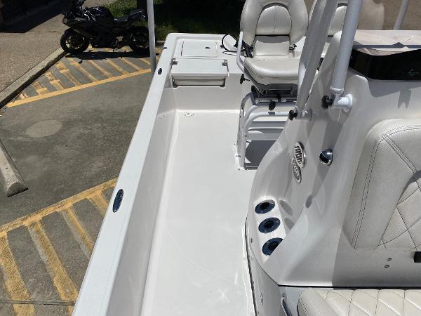 Slide: The Image of 2023 Blue Wave 2200 STL boat interior with seating and storage compartments. - 14