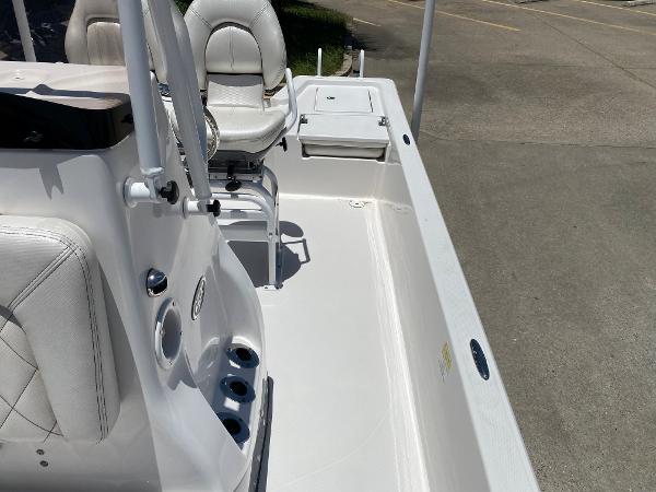 Slide: The Image of 2023 Blue Wave 2200 STL boat interior with white seating and console. - 15