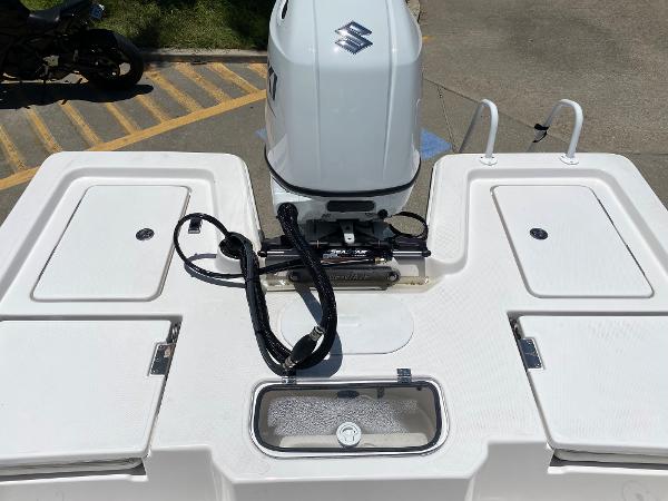 Slide: The Image of 2023 Blue Wave 2200 STL boat with Suzuki outboard motor, rear deck view. - 19