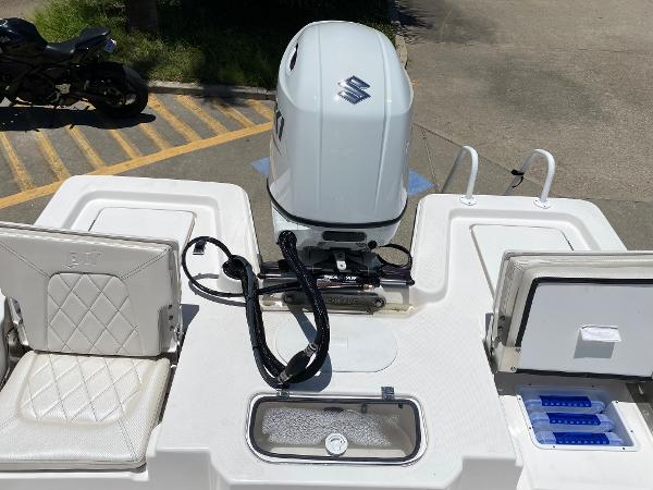Slide: The Image of 2023 Blue Wave 2200 STL boat with Suzuki outboard motor and seating. - 20
