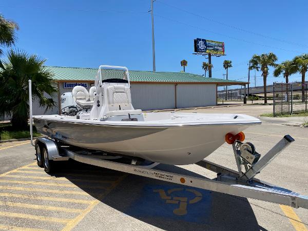 Slide: The Image of 2023 Blue Wave 2200 STL boat on a trailer in a parking lot. - 3