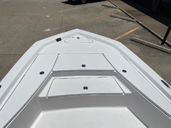 Slide: The Image of 2023 Blue Wave 2200 STL boat deck with storage compartments. - 8