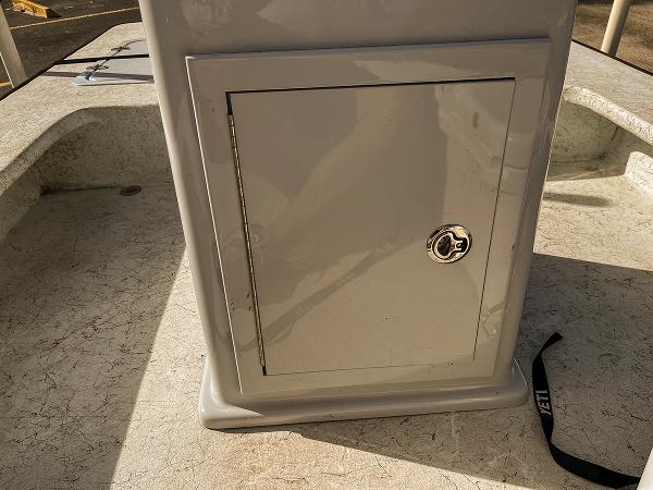 Slide: The Image of 2022 Bossman 17 Flats Boat console with storage compartment and latch. - 14