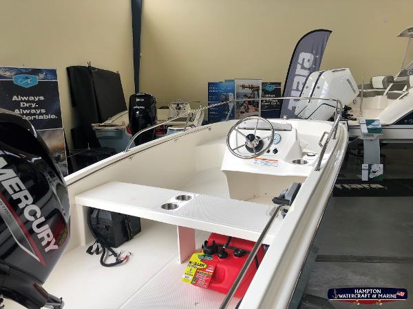 Slide: The Image of 2023 Boston Whaler 130 Super Sport boat on display at Hampton Watercraft & Marine. - 3