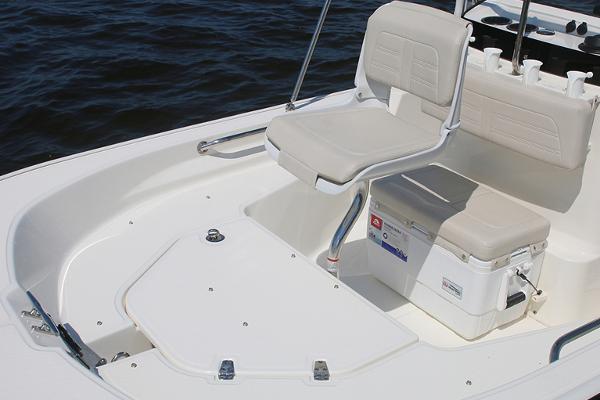 Slide: The Image of Manufacturer Provided Image: 2024 Boston Whaler 150 Montauk boat interior with seating and storage. - 21