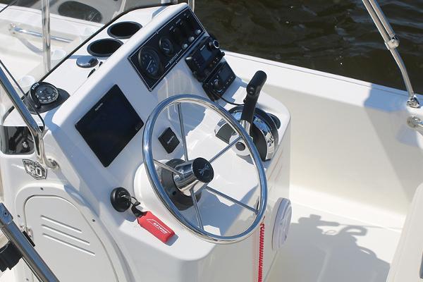 Slide: The Image of Manufacturer Provided Image: 2024 Boston Whaler 150 Montauk boat console with steering wheel and controls. - 23