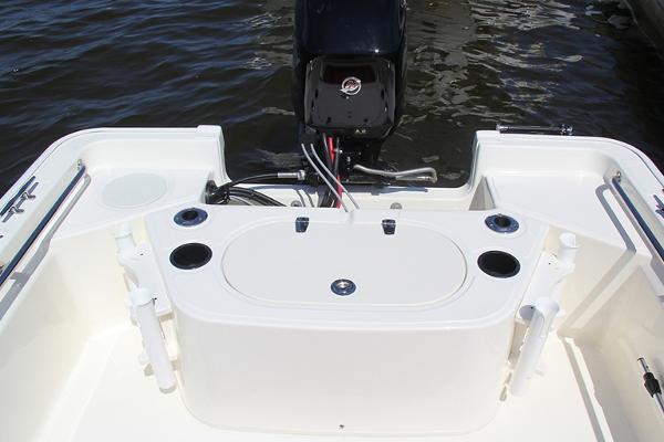 Slide: The Image of Manufacturer Provided Image: 2024 Boston Whaler 150 Montauk boat stern with motor and fishing rod holders. - 25