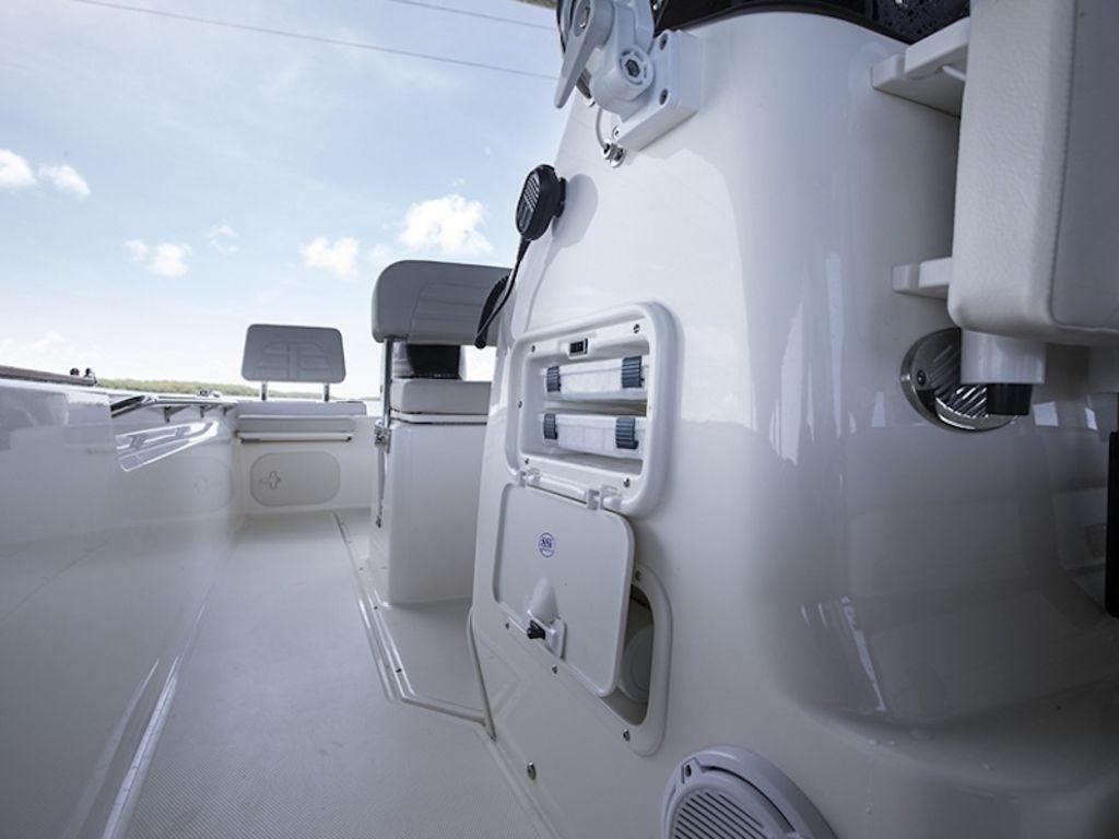 Slide: The Image of 2024 Boston Whaler 170 Montauk boat interior with seating and storage compartments. - 11