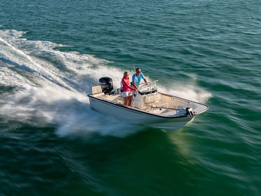 Slide: The Image of 2024 Boston Whaler 170 Montauk cruising on open water. - 3
