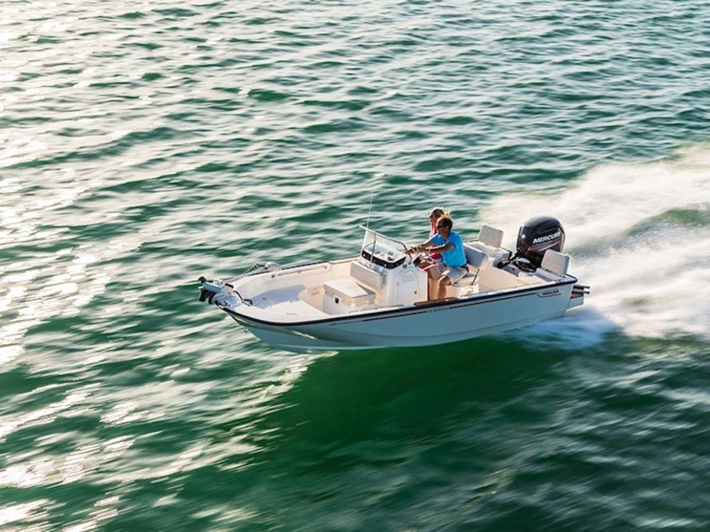 Slide: The Image of 2024 Boston Whaler 170 Montauk boat cruising on open water. - 6