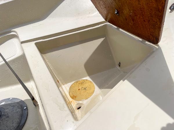 Slide: The Image of Open storage compartment on a 1976 Boston Whaler 150 Sport boat. - 12