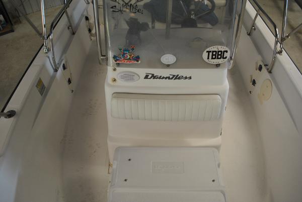Slide: The Image of 2001 Boston Whaler 16 Dauntless boat interior with console and seating. - 11
