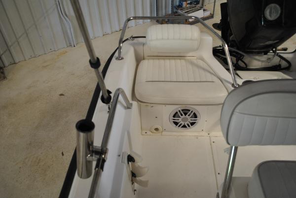 Slide: The Image of 2001 Boston Whaler 16 Dauntless boat interior with white seating and speaker. - 14