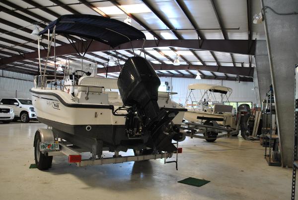 Slide: The Image of 2001 Boston Whaler 16 Dauntless boat in indoor storage facility. - 15