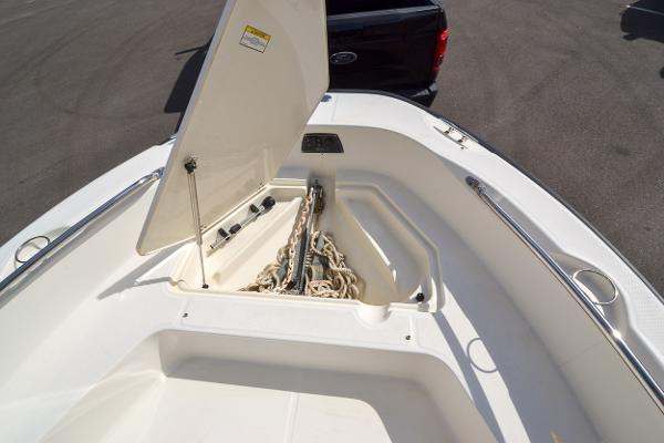 Slide: The Image of 2019 Boston Whaler 180 Dauntless anchor storage compartment with lid open. - 10