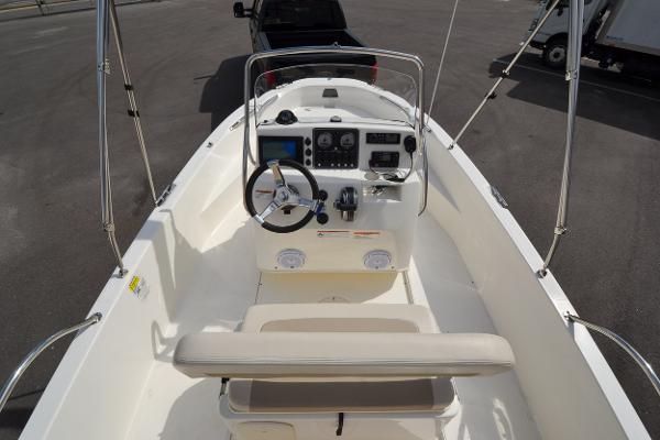 Slide: The Image of 2019 Boston Whaler 180 Dauntless boat interior with steering console and seating. - 25